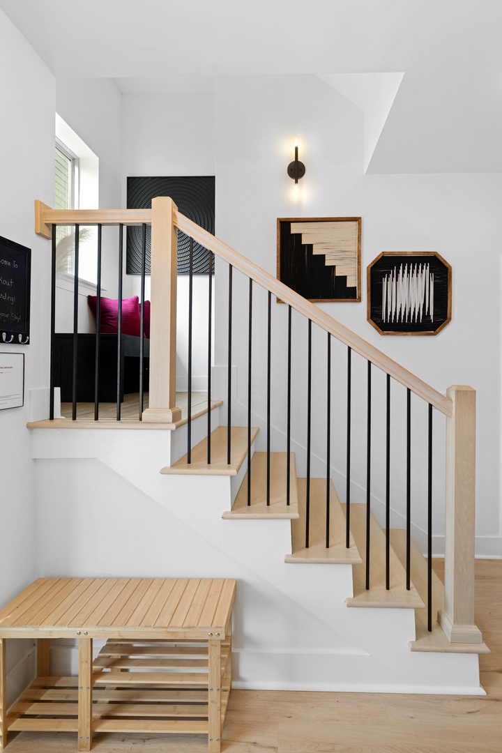 Stairs lead to the upstairs bedrooms and bathroom