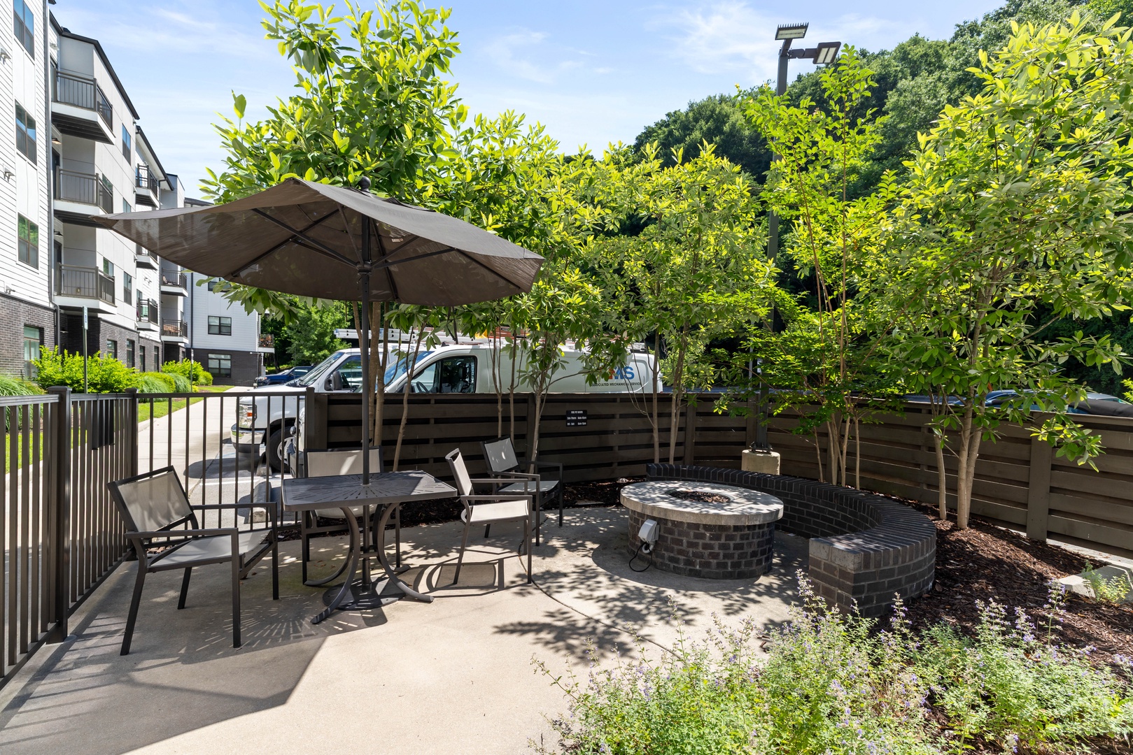 Gather around the shared outdoor fireplace, a cozy spot perfect for relaxing evenings and conversation after a day of exploring.