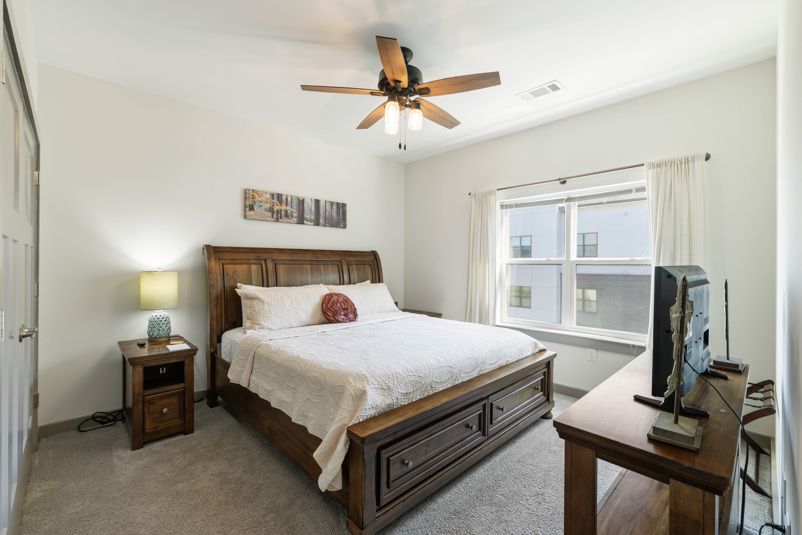 Stretch out and enjoy the comfort of the plush king bed with soft linens and cozy bedding.