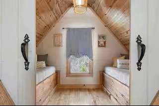 This welcoming additional bedroom features two twin beds, offering a comfortable and flexible sleeping arrangement for guests, children, or friends traveling together.