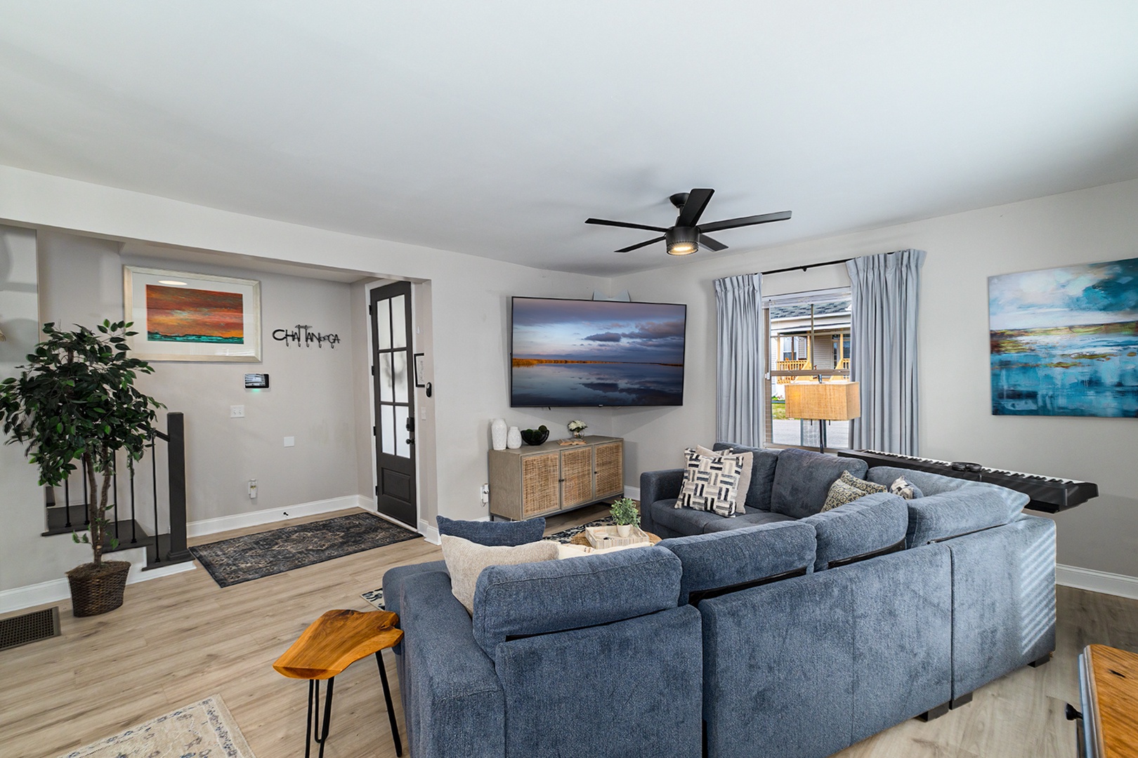 Living room with tv and piano