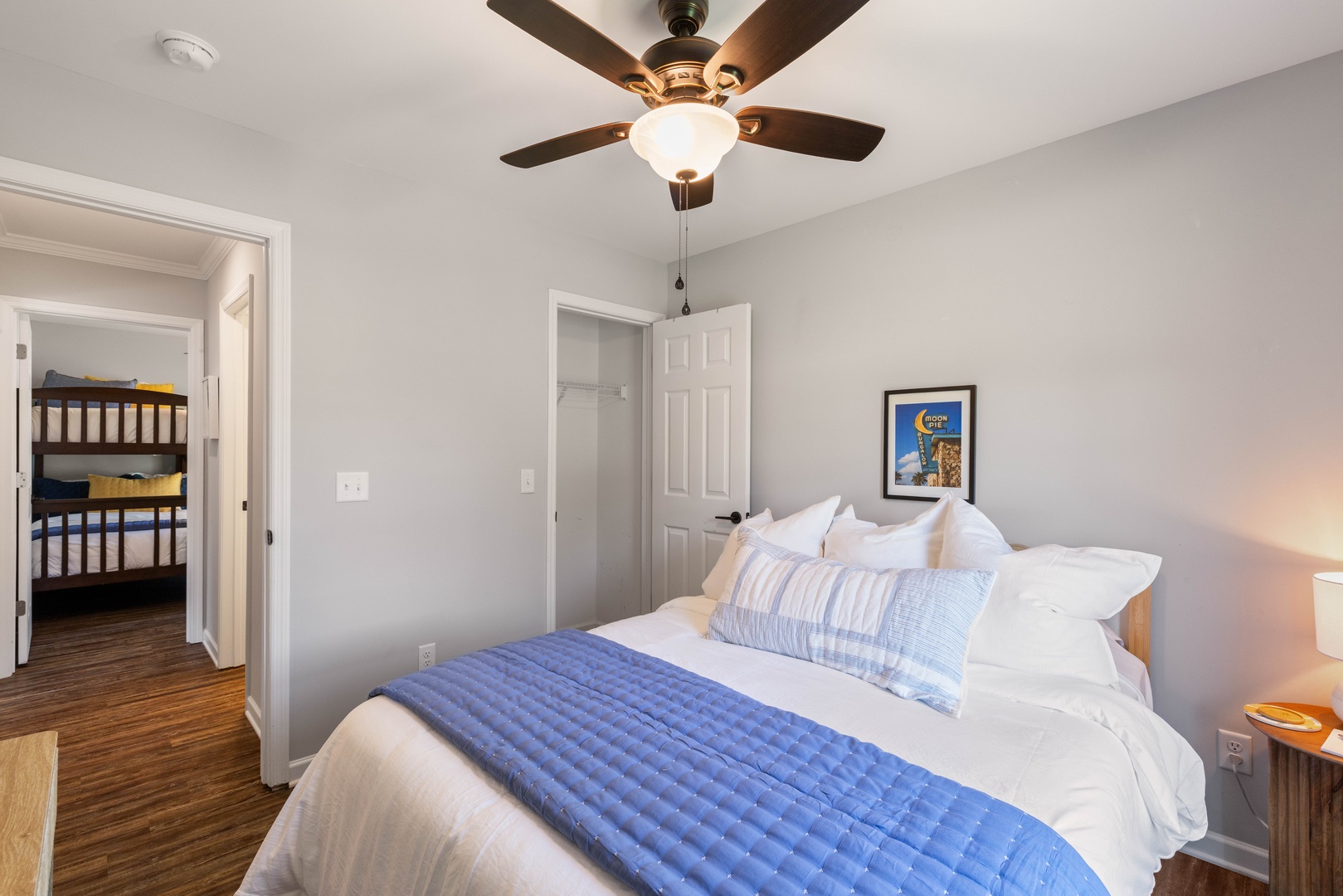 Settle into your Serene Bedroom with a Plush Queen Bed Dressed in Soft Linens.