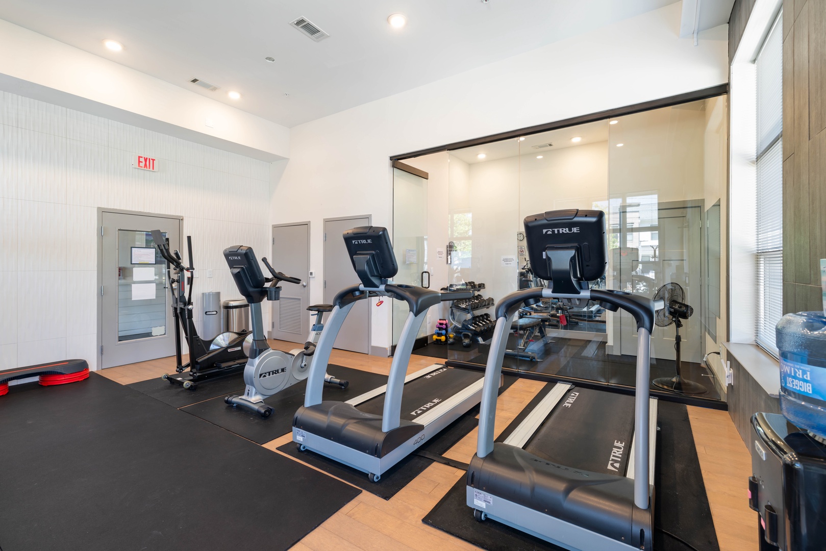 Stay on track with your routine in the shared fitness center featuring treadmills and cardio equipment for a great workout.