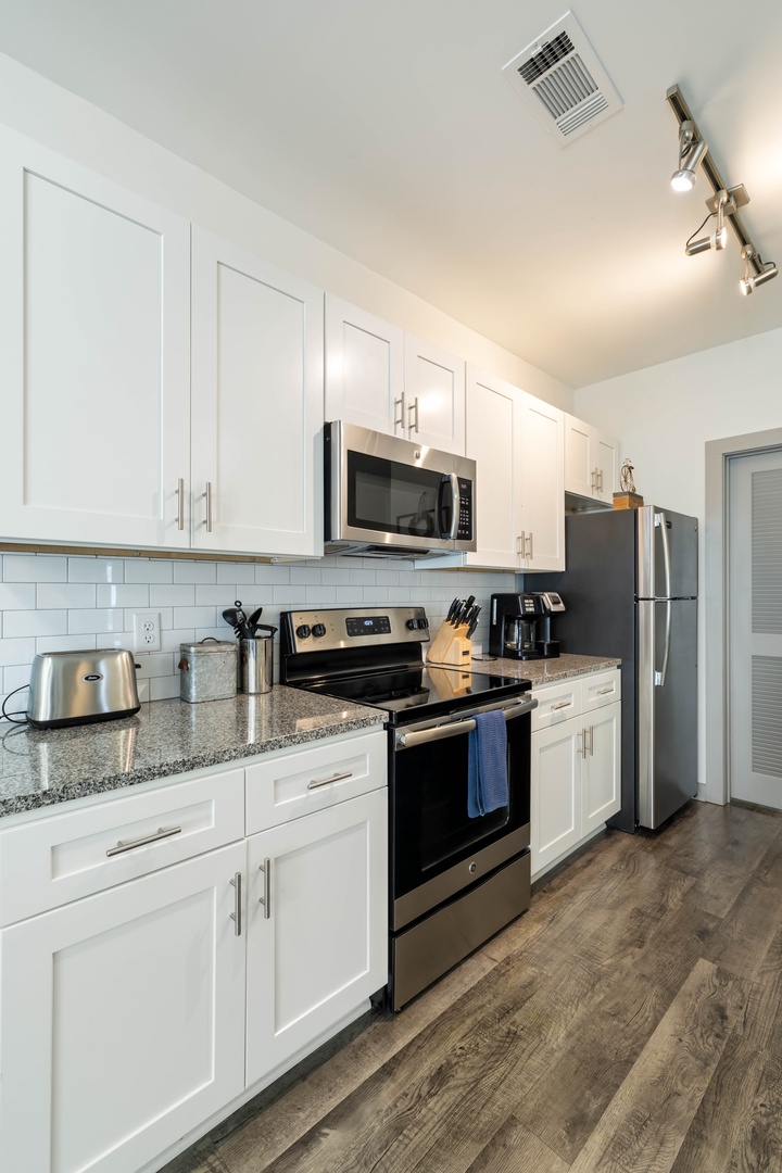Enjoy the convenience of full size appliances, ample counter space, and all the essentials for cooking and dining.
