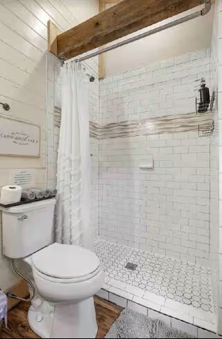 Refresh and unwind in the spacious standing shower, featuring a clean and modern design with plenty of room to enjoy a comfortable start or relaxing end to your day.