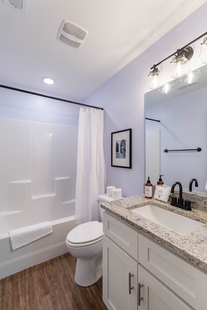 Bathroom with bathtub and shower