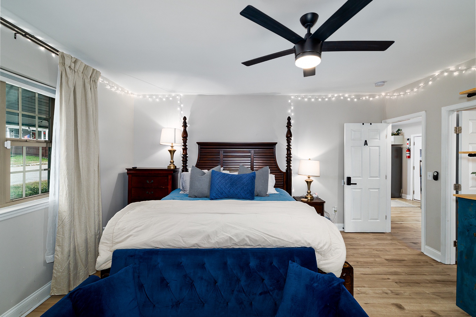 Master bedroom with attached bath, king bed, and work space