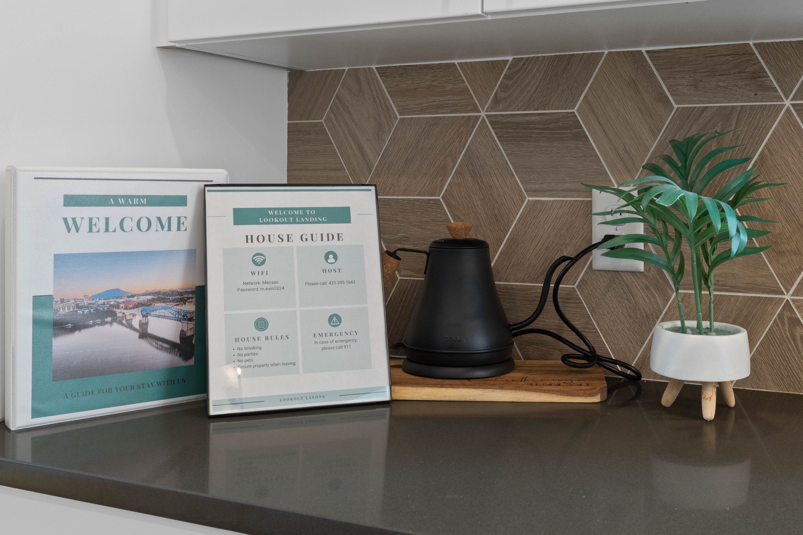 Welcome book with house information and a water kettle