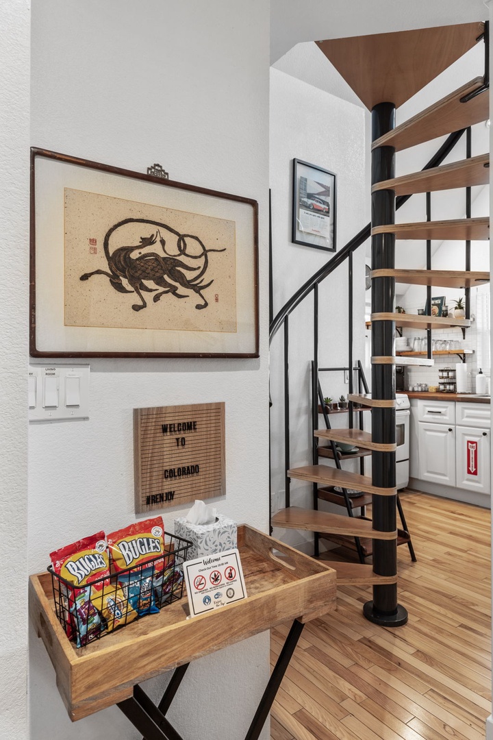 Your cozy Colorado retreat welcomes you with local charm, featuring a spiral staircase and thoughtful snacks for your arrival.