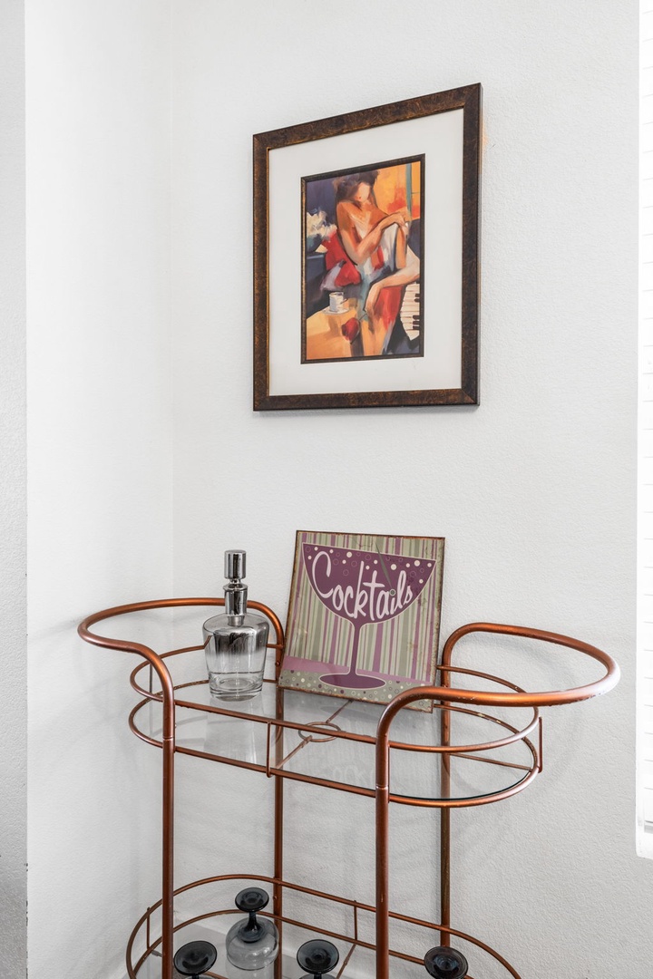 Your stylish bar cart awaits with vintage charm, ready for you to craft cocktails and unwind in sophisticated comfort.
