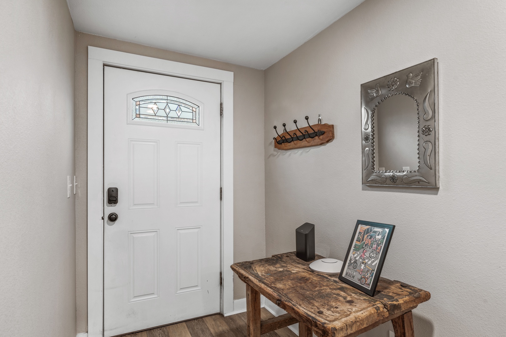 Step into your welcoming entryway, where rustic wood touches and thoughtful decor create a warm first impression for your stay.