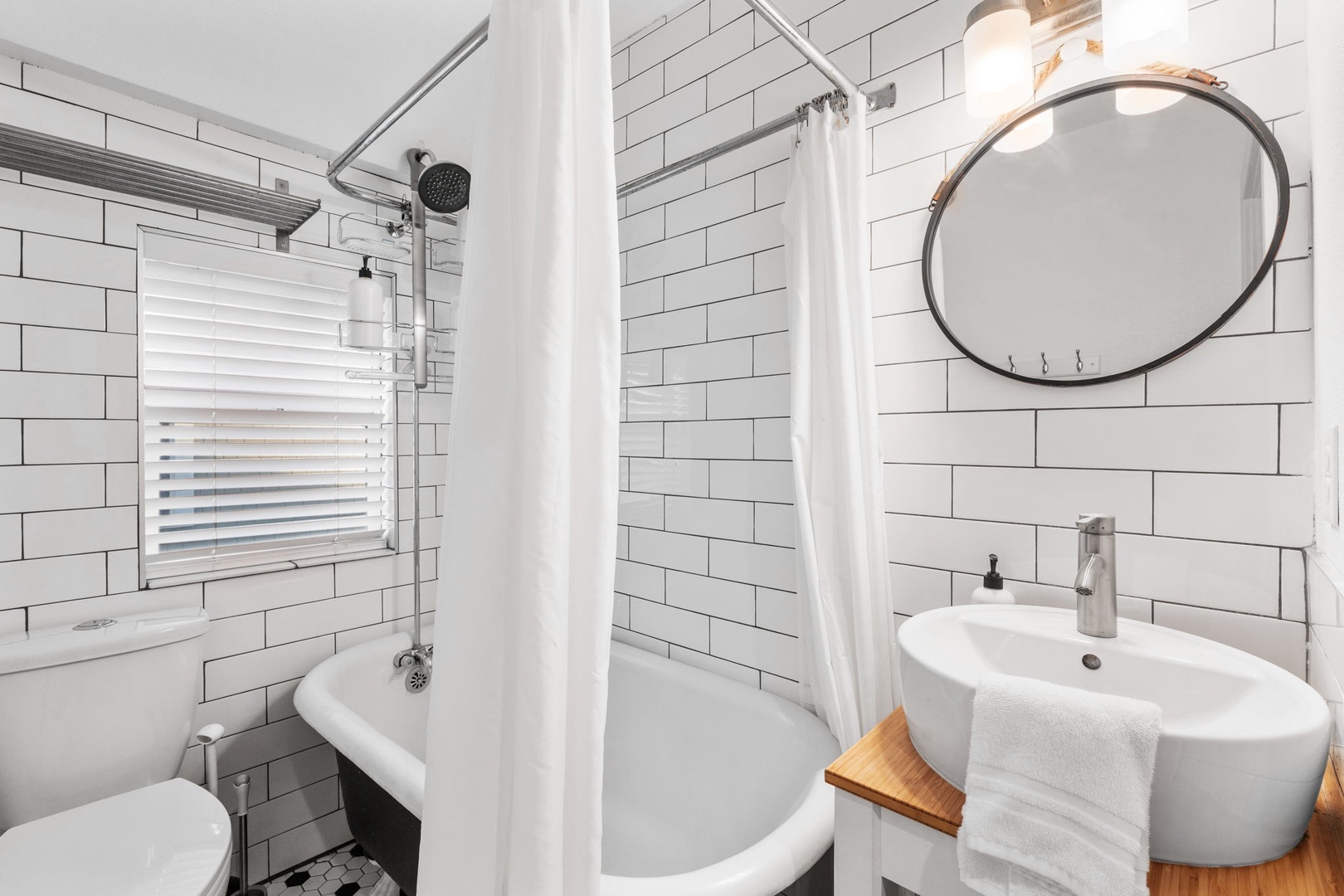 Step into your stylish bathroom featuring crisp subway tiles and a relaxing tub-shower combination for your daily refresh.