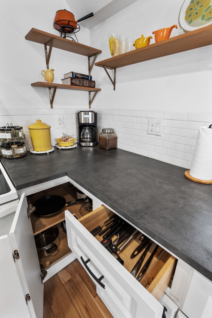 Your well-equipped kitchen features everything you need, from a coffee maker for morning brews to organized storage for all your cooking adventures.