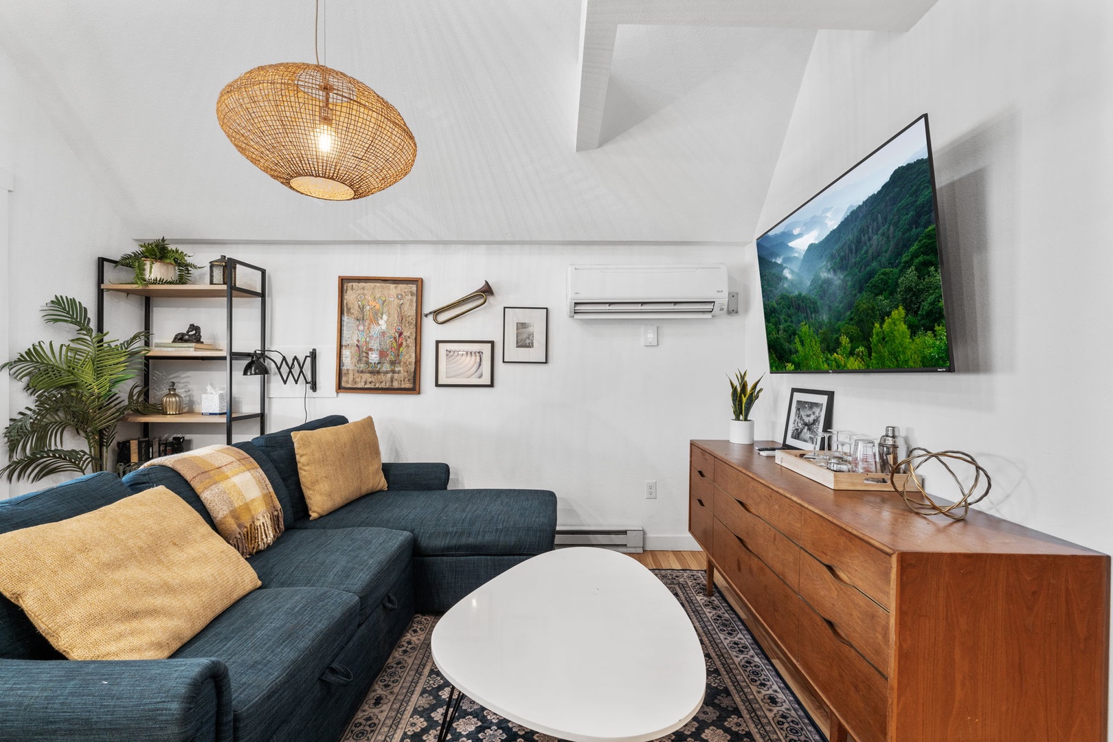 Sink into your stylish retreat with a plush sectional, warm woven textures, and modern comforts perfectly arranged for relaxing evenings.