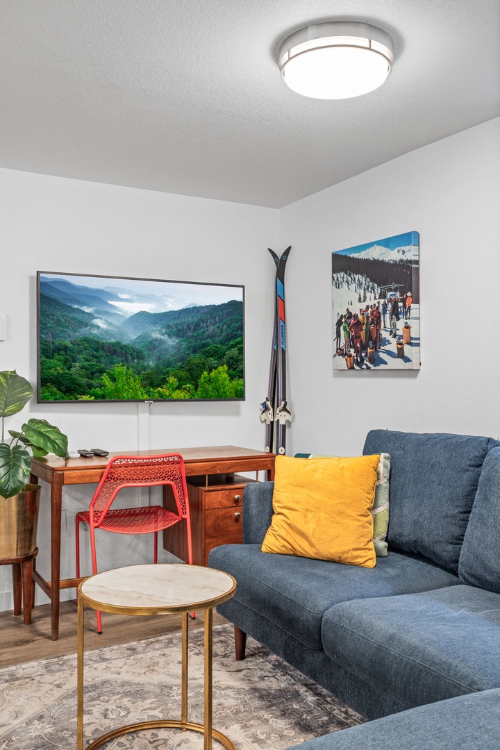 Unwind in your stylish living space with modern comfort and mountain adventure inspiration surrounding you.