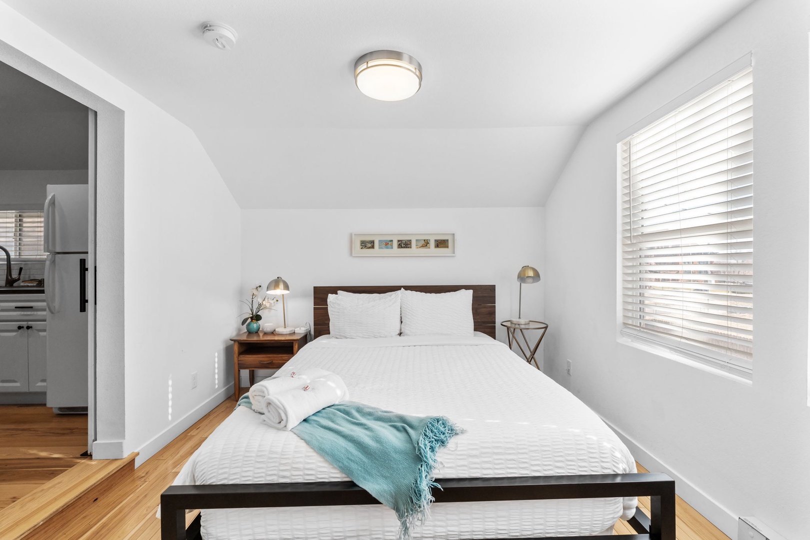 Drift off in your peaceful retreat with vaulted ceilings, crisp linens, and warm hardwood floors beneath your feet.