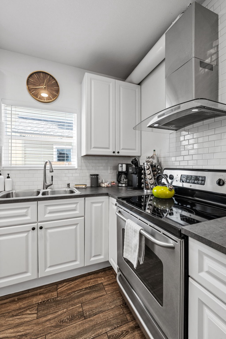 Your fully equipped kitchen features modern stainless steel appliances, granite countertops, and everything you need to create memorable meals during your stay.