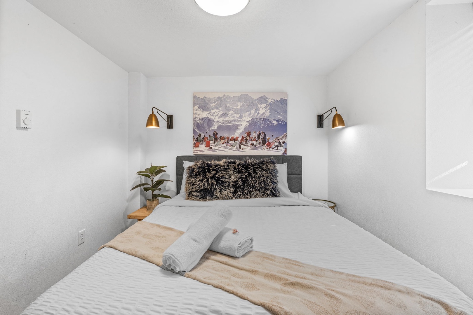 Drift into peaceful sleep in your cozy bedroom with crisp linens, warm lighting, and mountain-inspired decor creating a serene alpine retreat.