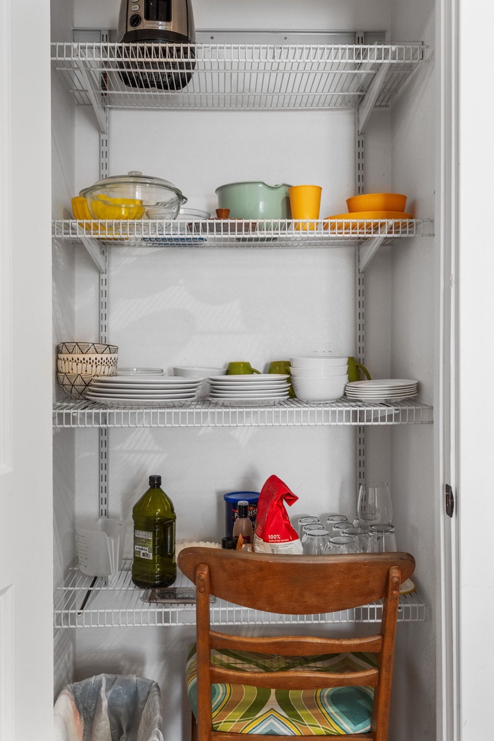 Your well-organized pantry keeps dishes, glassware, and essentials perfectly arranged on adjustable shelves, making meal prep effortless and enjoyable.