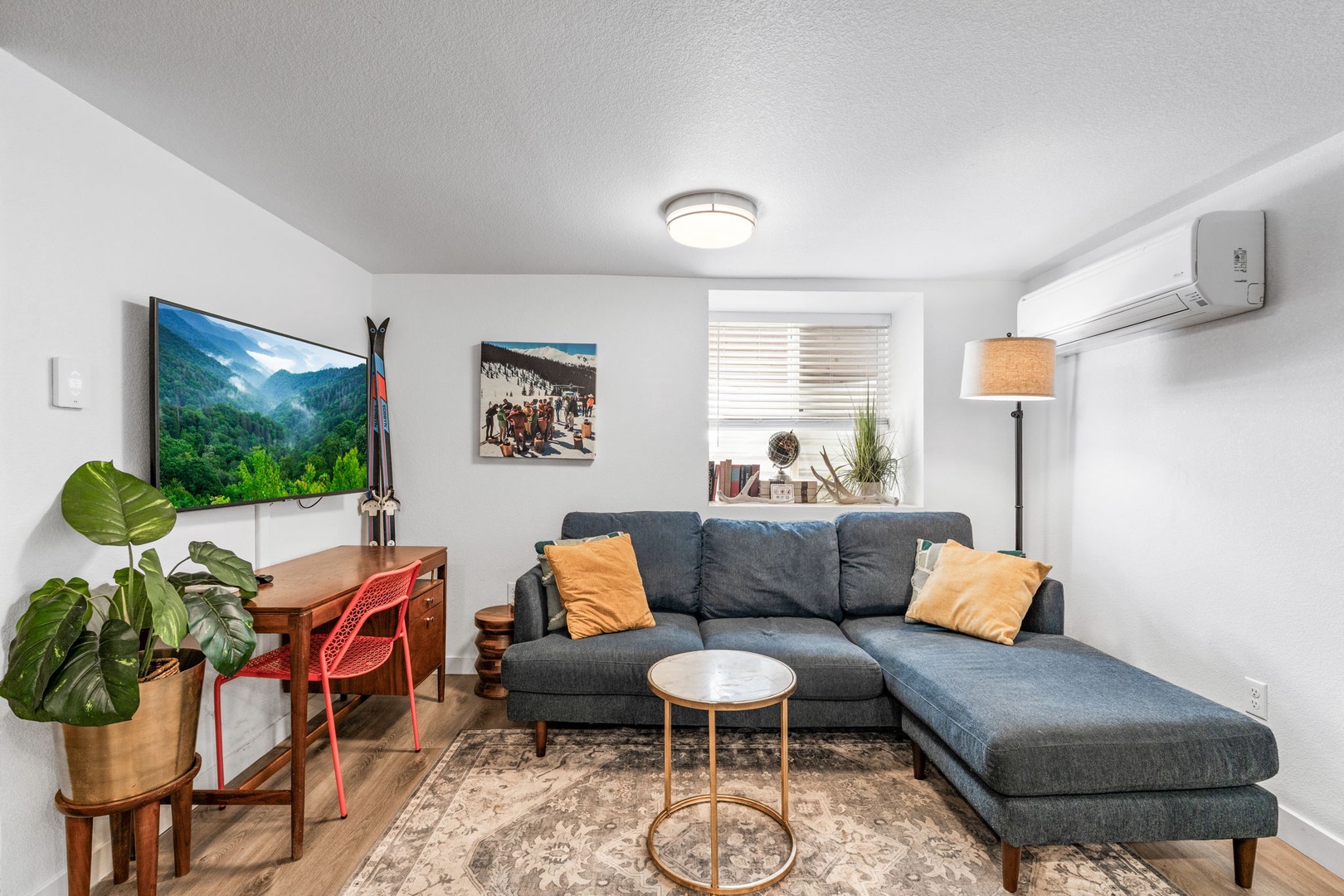 Sink into this stylish sectional sofa where you'll unwind after exploring. Modern touches, natural light, and thoughtful decor create your perfect retreat.