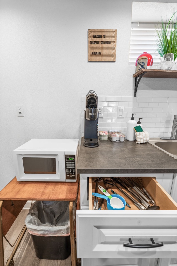 Your well-equipped kitchenette has everything you need - microwave, coffee maker, and thoughtful storage for your home-away-from-home comfort.