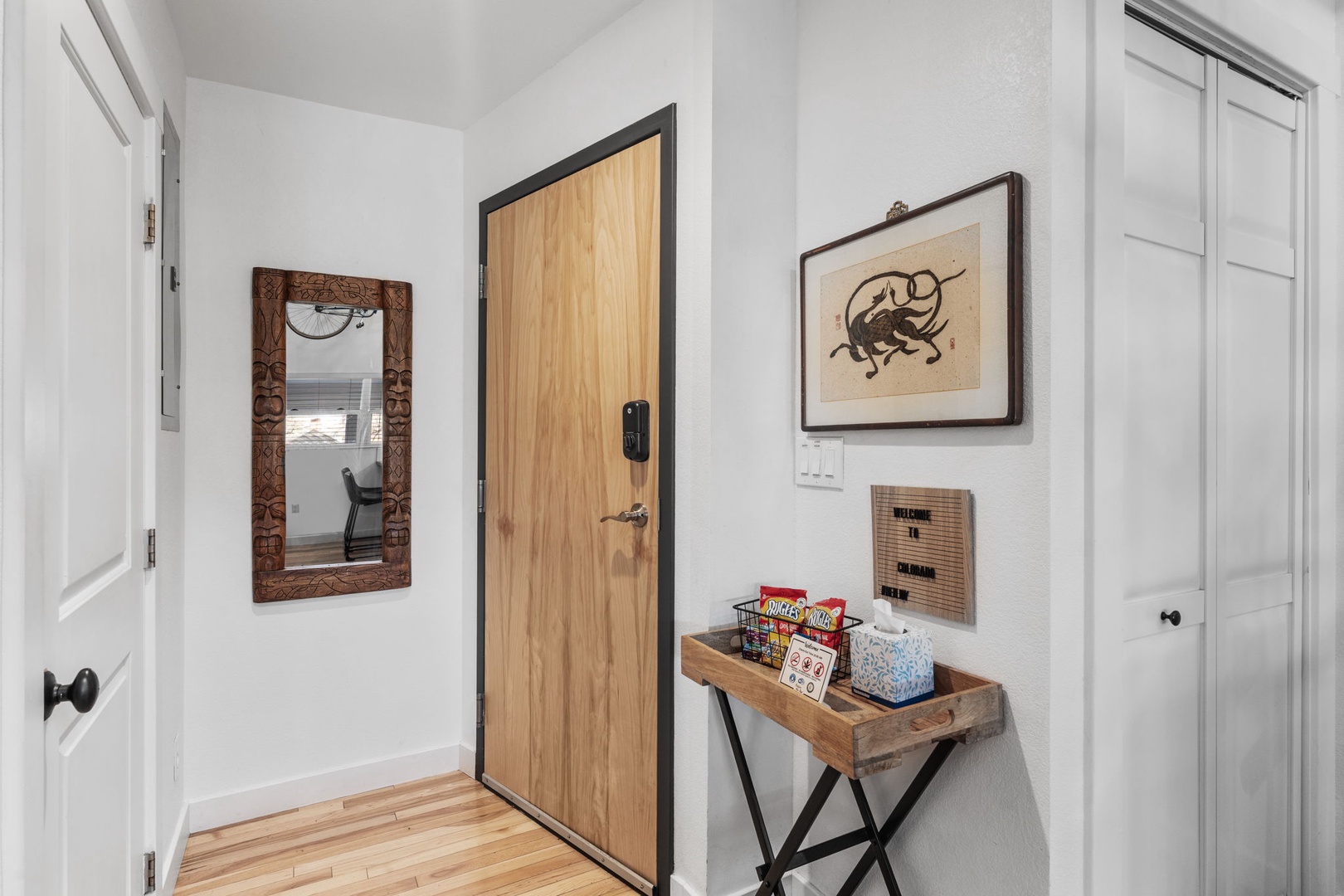 Step into your welcoming entryway where thoughtful touches and warm wood accents create an instantly homey atmosphere for your stay.