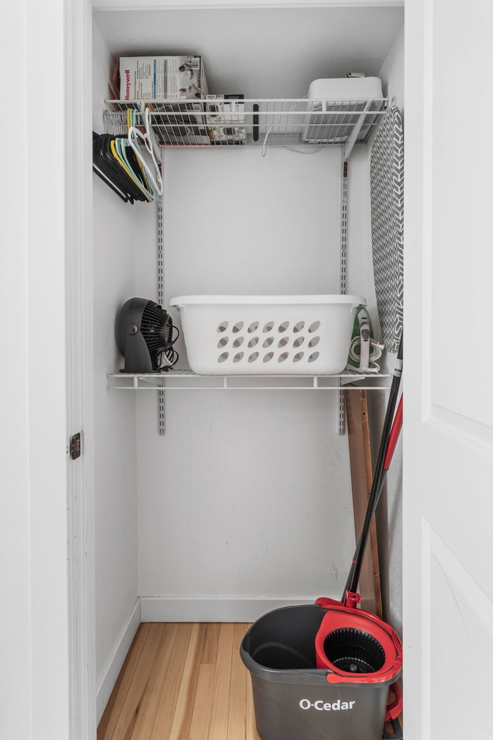 Your organized utility closet keeps cleaning supplies and essentials neatly stored, making your stay comfortable and convenient.