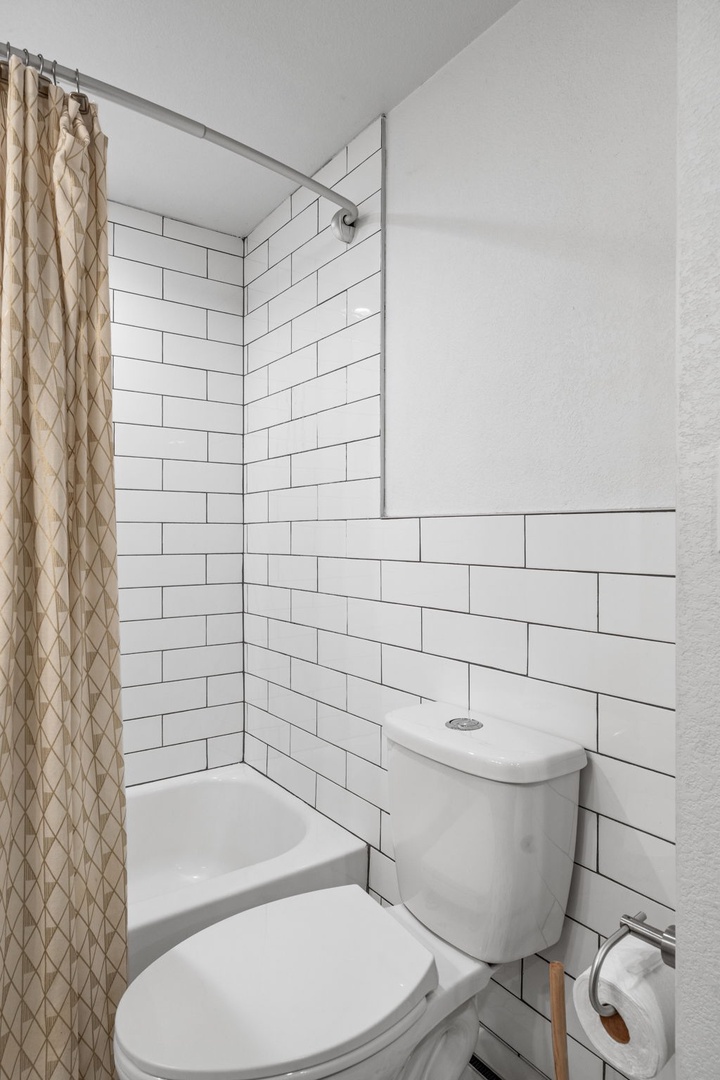 Refresh in your stylish bathroom with classic subway tiles and modern fixtures—everything you need for comfort.