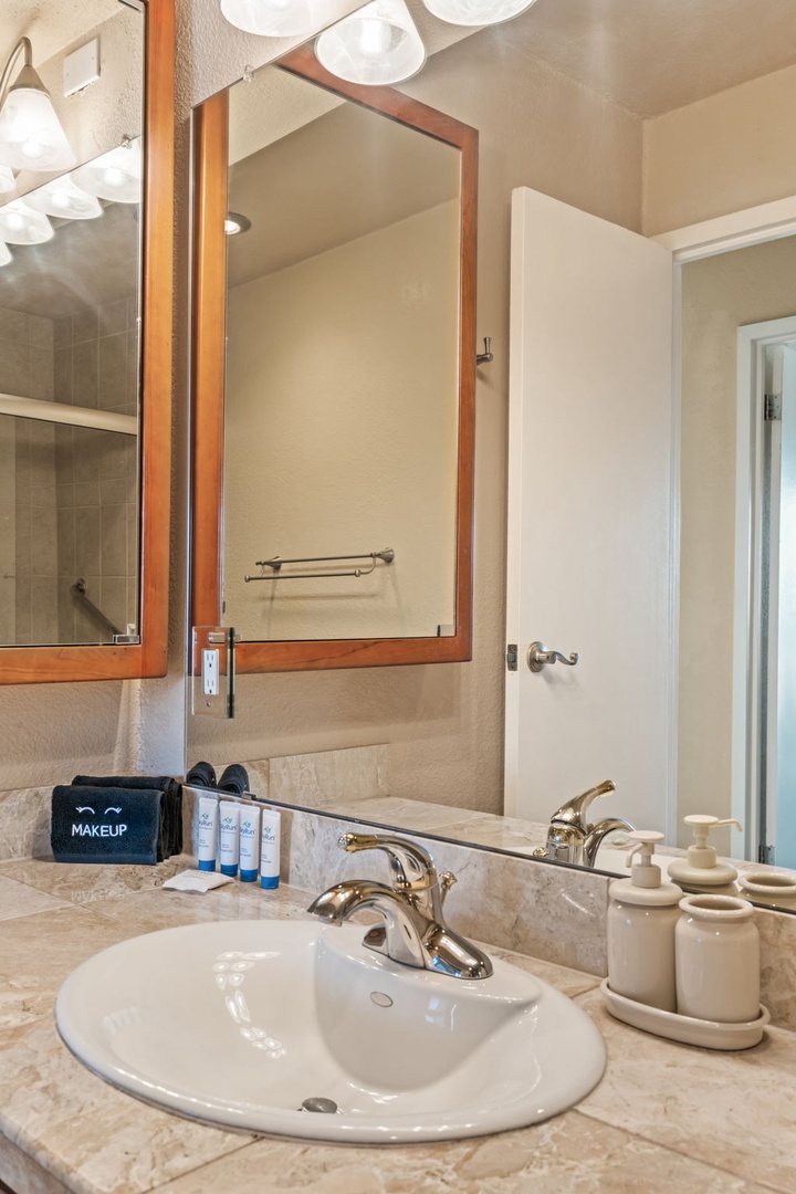 Your private bathroom features polished marble countertops, elegant fixtures, and soft lighting—freshly stocked with essentials for a refreshing start to your day.