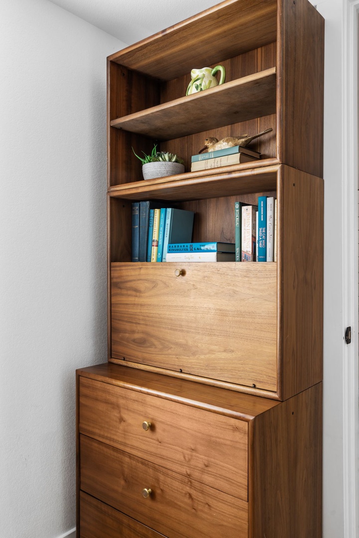 Curl up with your favorite books from this elegant built-in library, perfectly styled with plants and storage for all your personal treasures.