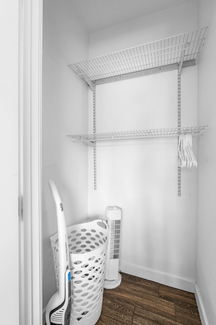 Your private laundry closet features organized shelving and space for all your washing needs during your stay.