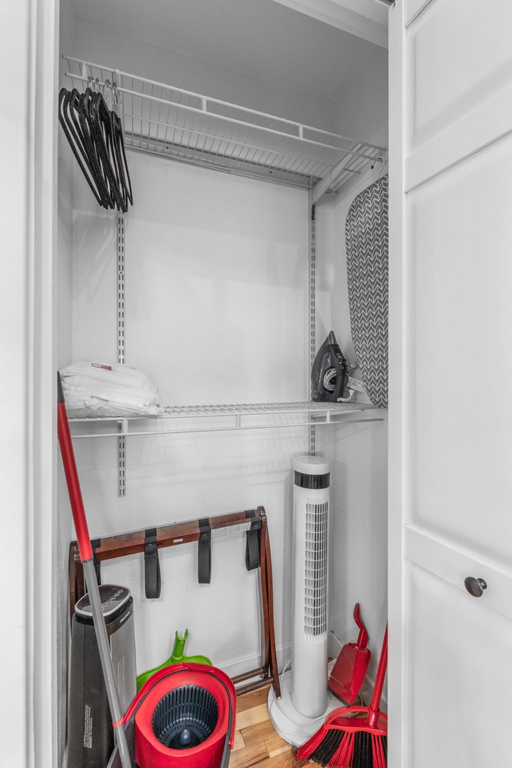 Your organized utility closet features smart storage solutions with shelving, hangers, and cleaning supplies—everything thoughtfully arranged for your convenience.