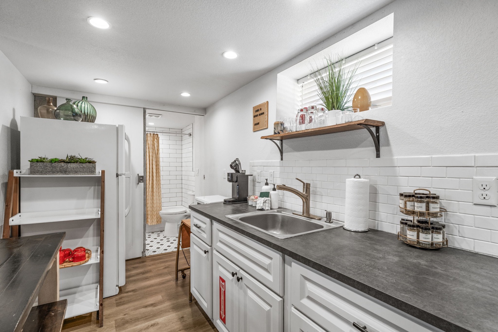 Your bright kitchen awaits with sleek counters, modern appliances, and thoughtful touches that make meal prep a joy.