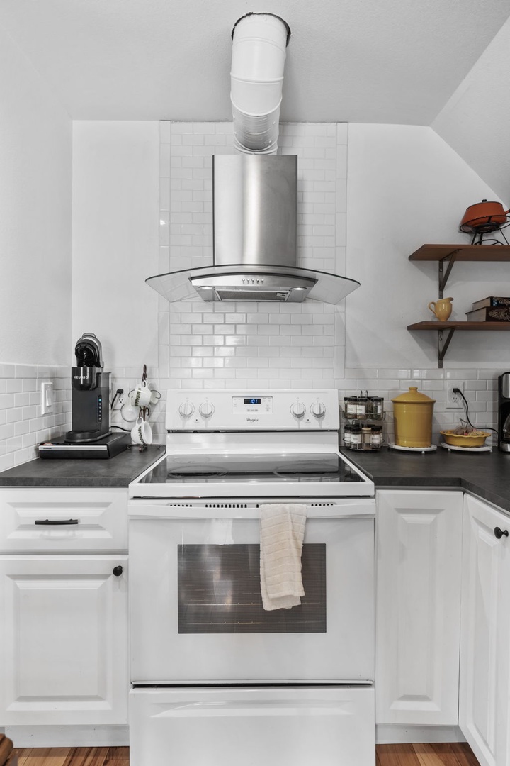 Step into your beautifully appointed kitchen featuring pristine white cabinets, sleek granite counters, and stainless steel appliances ready for your culinary adventures.