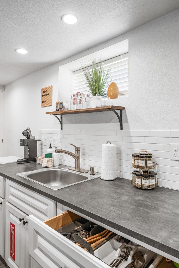 Your well-equipped kitchen features sleek countertops, modern appliances, and thoughtful touches that make cooking feel effortless and enjoyable.