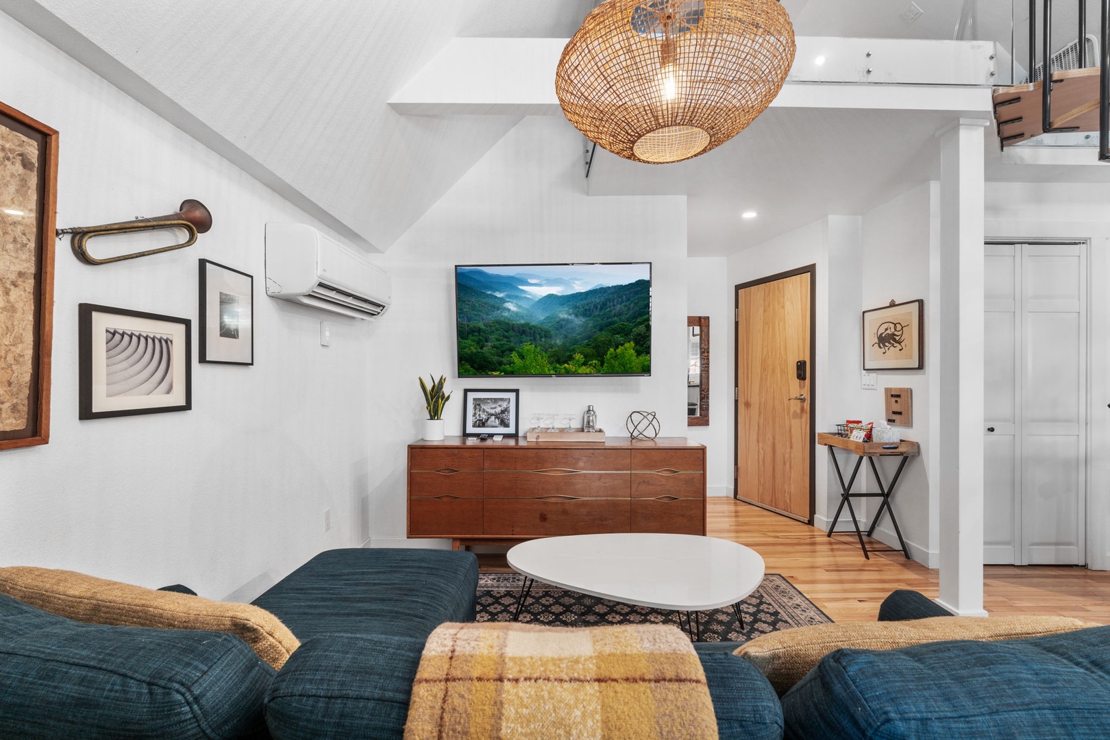 Your stylish living room combines modern comfort with thoughtful design, featuring plush seating and warm lighting.