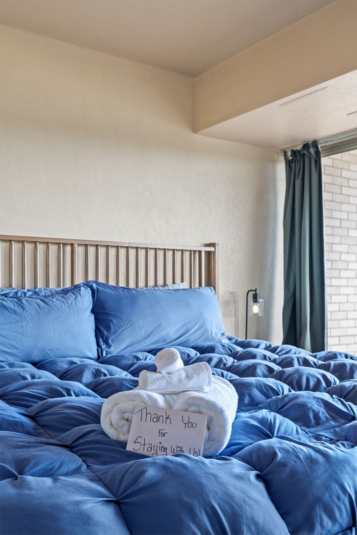 Sink into plush, inviting bedding with a warm welcome waiting for you. Soft linens and thoughtful touches make this your cozy retreat after a day of exploring.