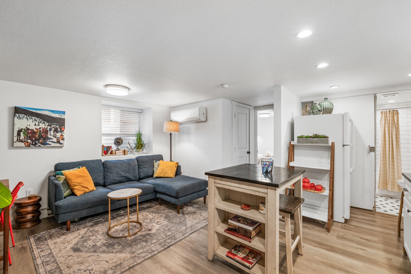 Relax in your stylish living space with cozy sectional seating, modern amenities, and thoughtful touches throughout your comfortable retreat.