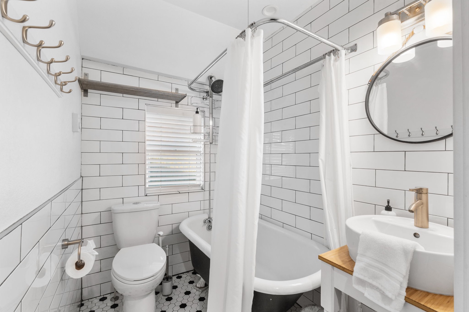 Step into your beautifully designed bathroom featuring a relaxing clawfoot tub, modern fixtures, and classic subway tiles that create a perfect blend of vintage charm and contemporary comfort.