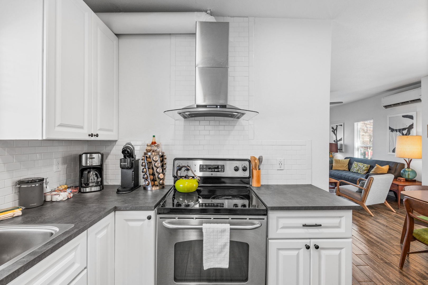 Your fully equipped kitchen awaits with modern appliances and sleek granite countertops, perfect for preparing meals during your stay.