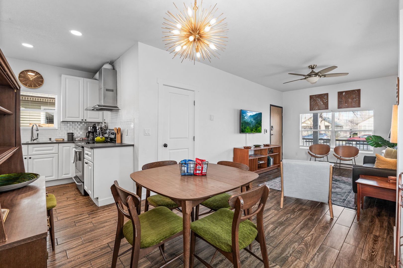 Your stylish open-plan space features a fully equipped kitchen, cozy dining area, and comfortable living room with modern touches throughout.