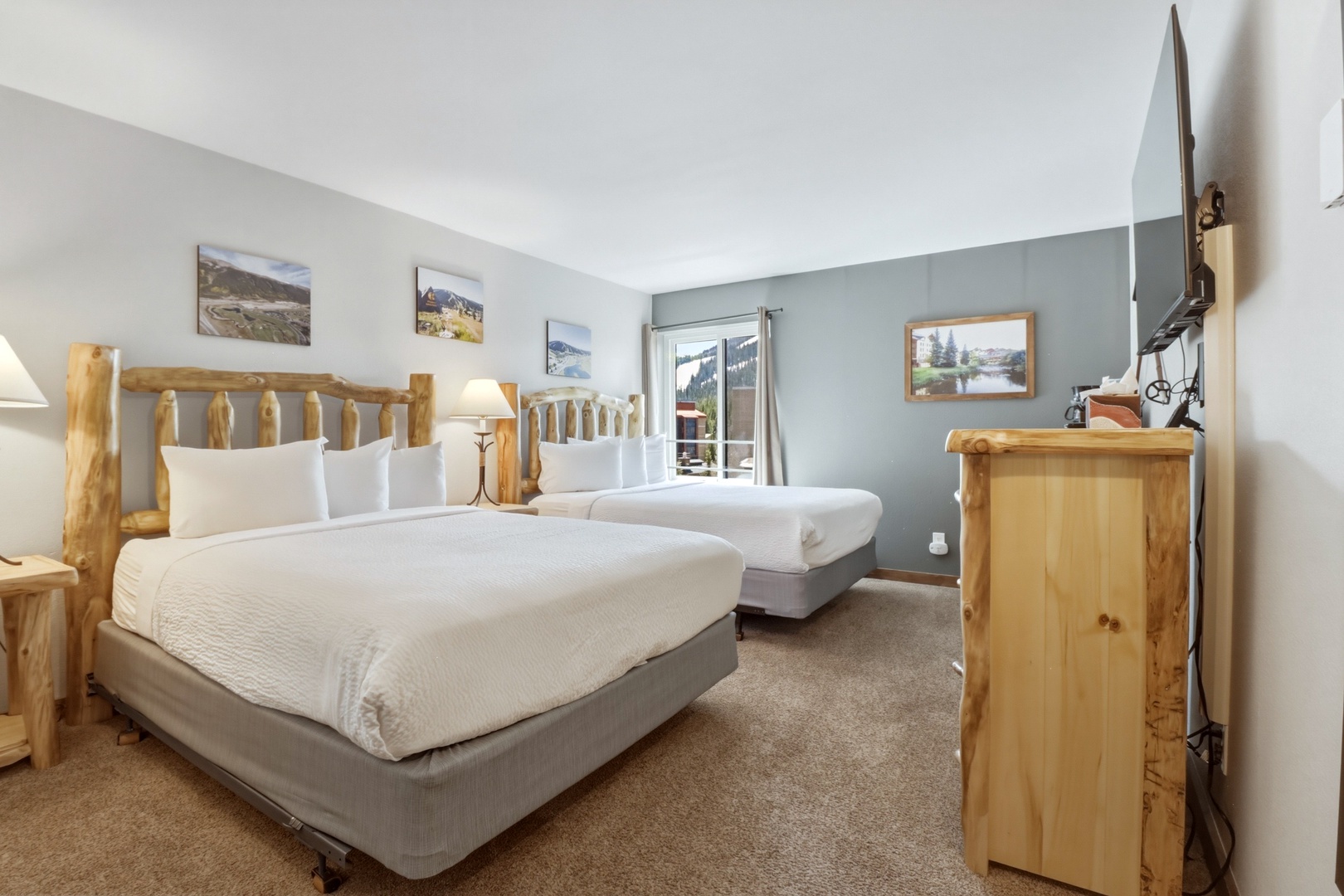 Rest comfortably in your cozy mountain retreat with rustic log headboards, crisp linens, and peaceful alpine views from your private balcony.