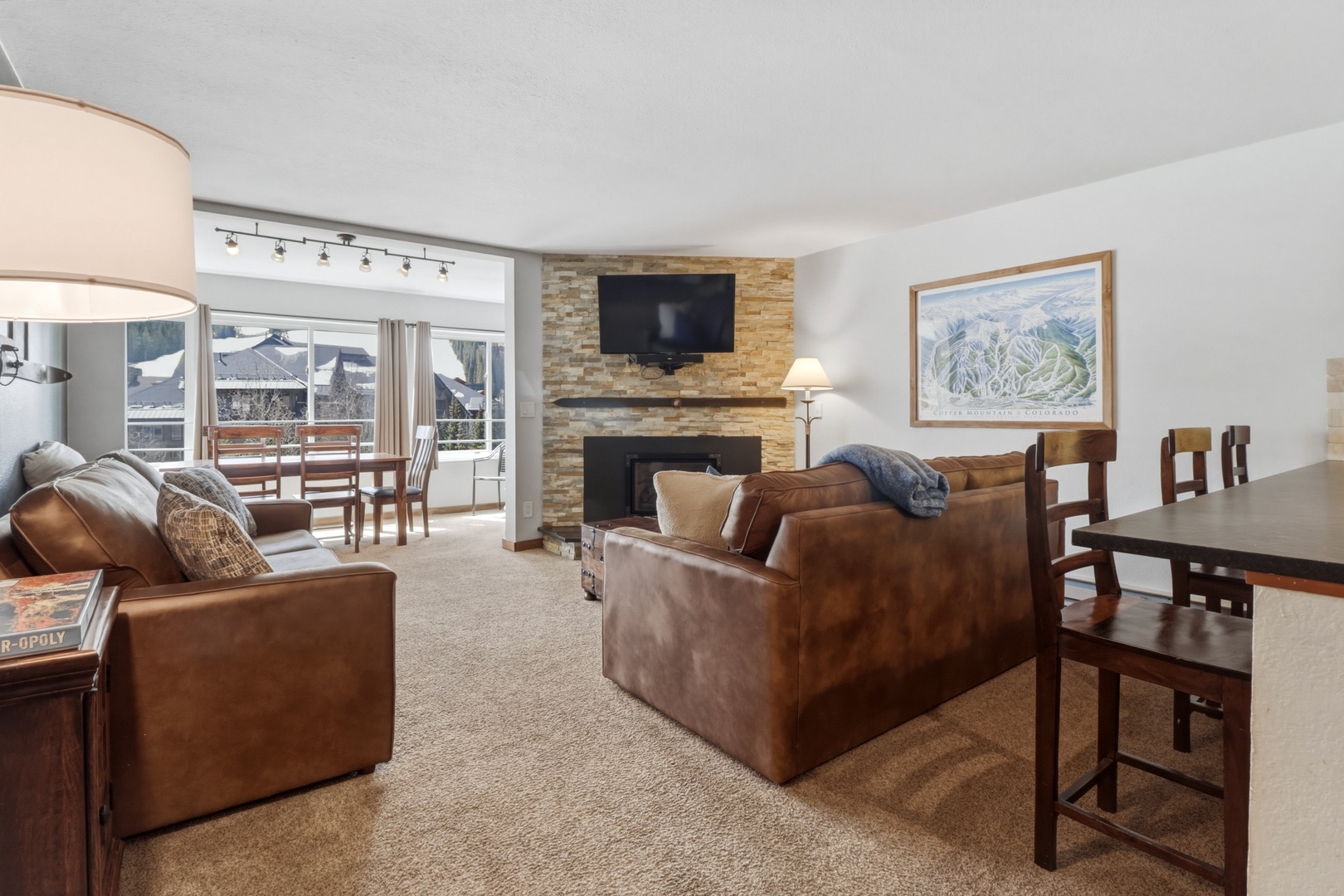 Sink into plush leather seating by your crackling fireplace, with mountain views beckoning from your private balcony.