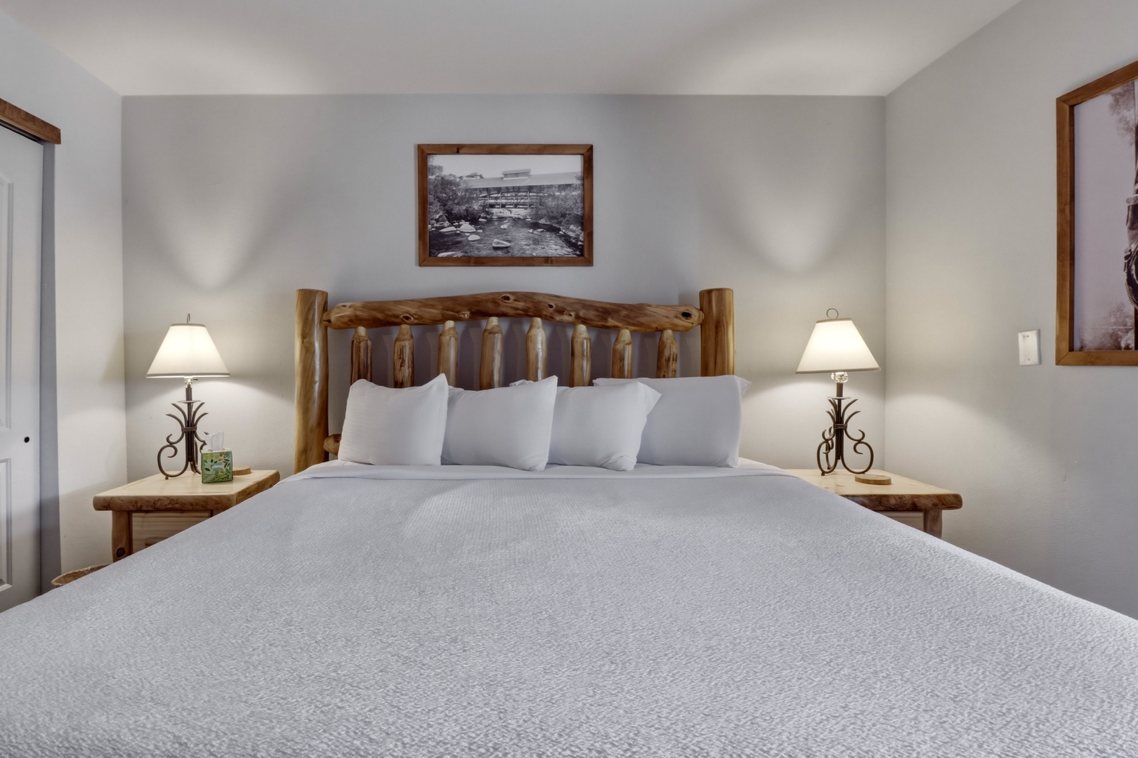 Your peaceful bedroom features rustic log furniture and soft lighting, creating a cozy mountain retreat atmosphere for restful nights.