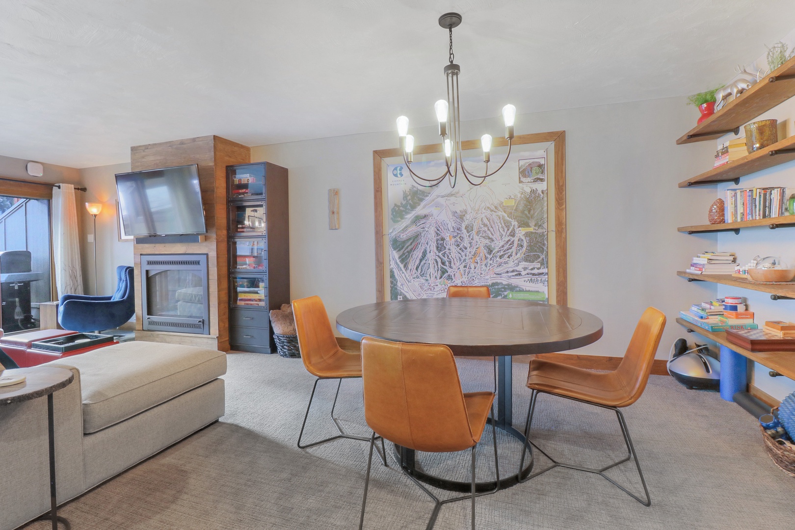 Step into your stylish mountain retreat where warm wood tones and modern comfort create the perfect après-ski atmosphere. Gather around the sleek dining table or cozy up by the fireplace while taking in those stunning alpine views.