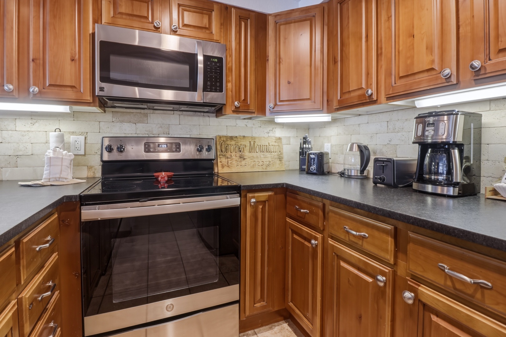 Your fully-equipped kitchen features rich wood cabinetry, modern appliances, and everything you need to create memorable meals during your stay.