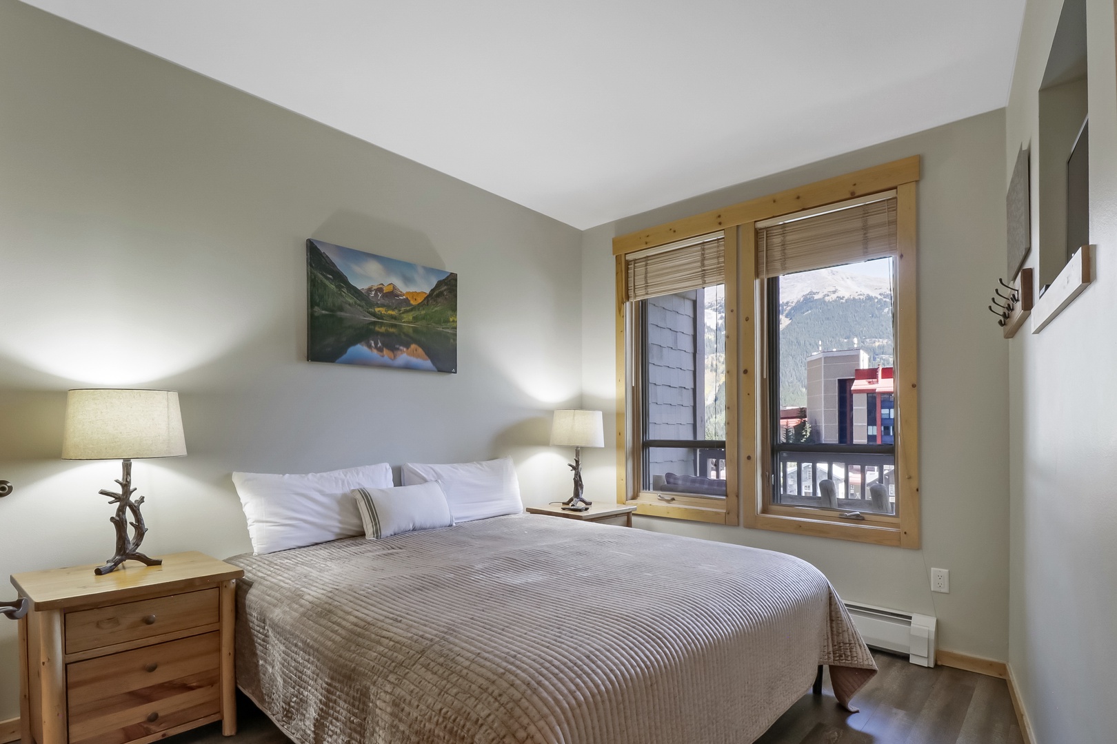 Sink into crisp linens and wake up to mountain views framed by your private window. Natural wood touches and soft lighting create the perfect retreat after your mountain adventures.