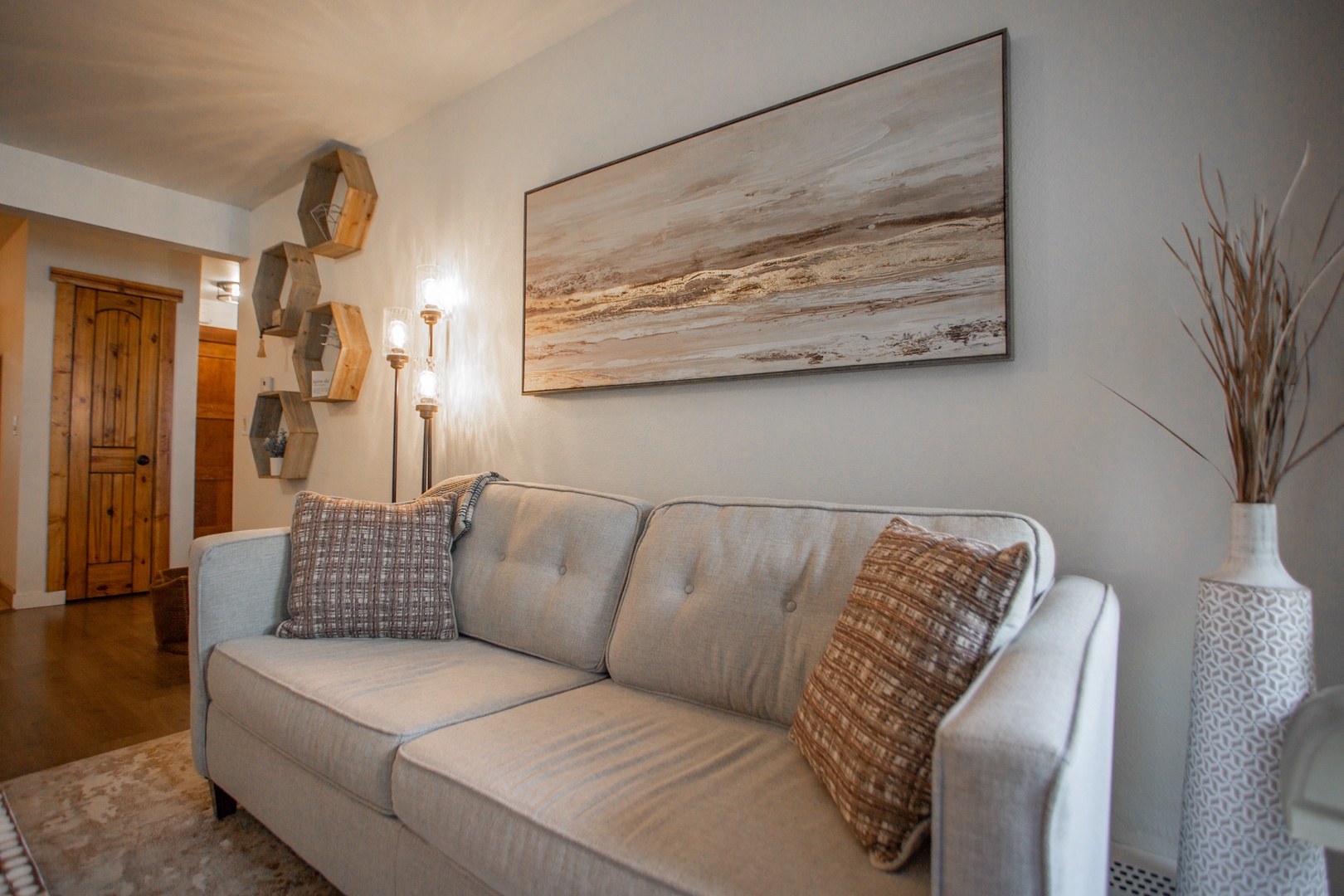 Settle into your cozy living space, where soft lighting and modern touches create the perfect retreat after a day of adventure.