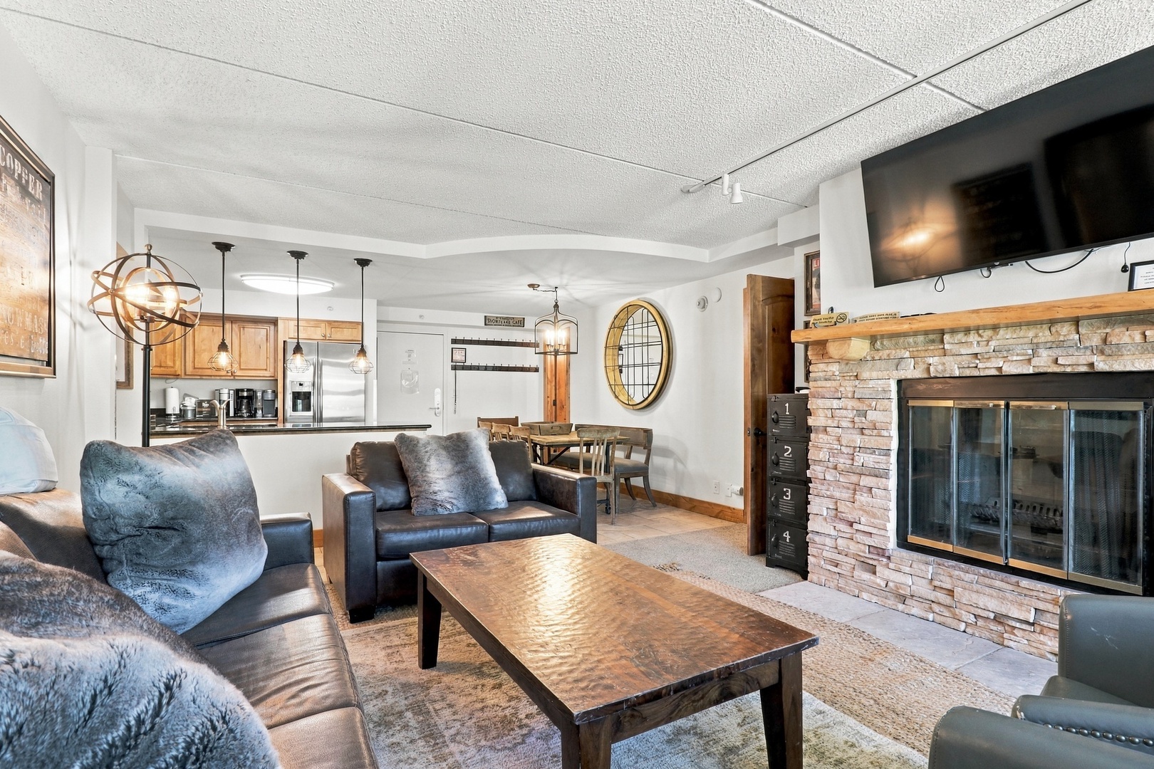 Sink into plush seating and feel the warmth of your stone fireplace. The open layout connects your living space to the dining area and kitchen, making it easy to gather everyone together after a day of adventure.