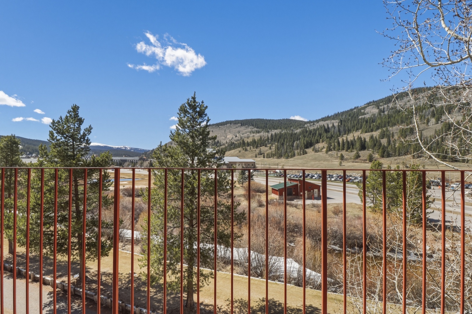 Mountain views stretch across forested hills and open valleys from this elevated vantage point near the property.